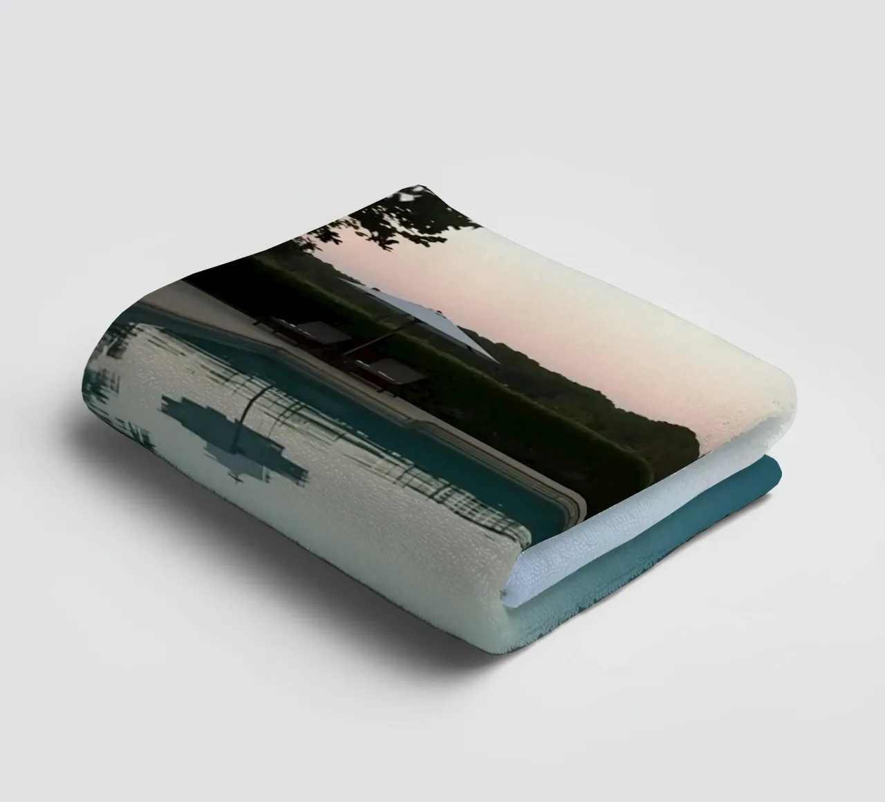 Swimming Pool Reflecting Palm Trees and Umbrellas at Dusk towel by DesignDoodle