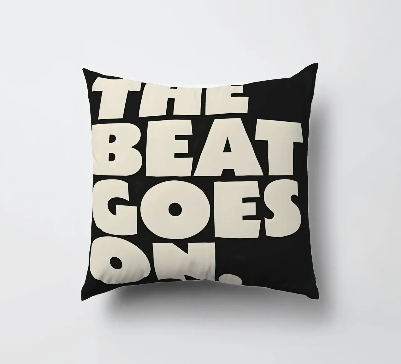 "THE BEAT GOES ON." cuscino da Type & Tape