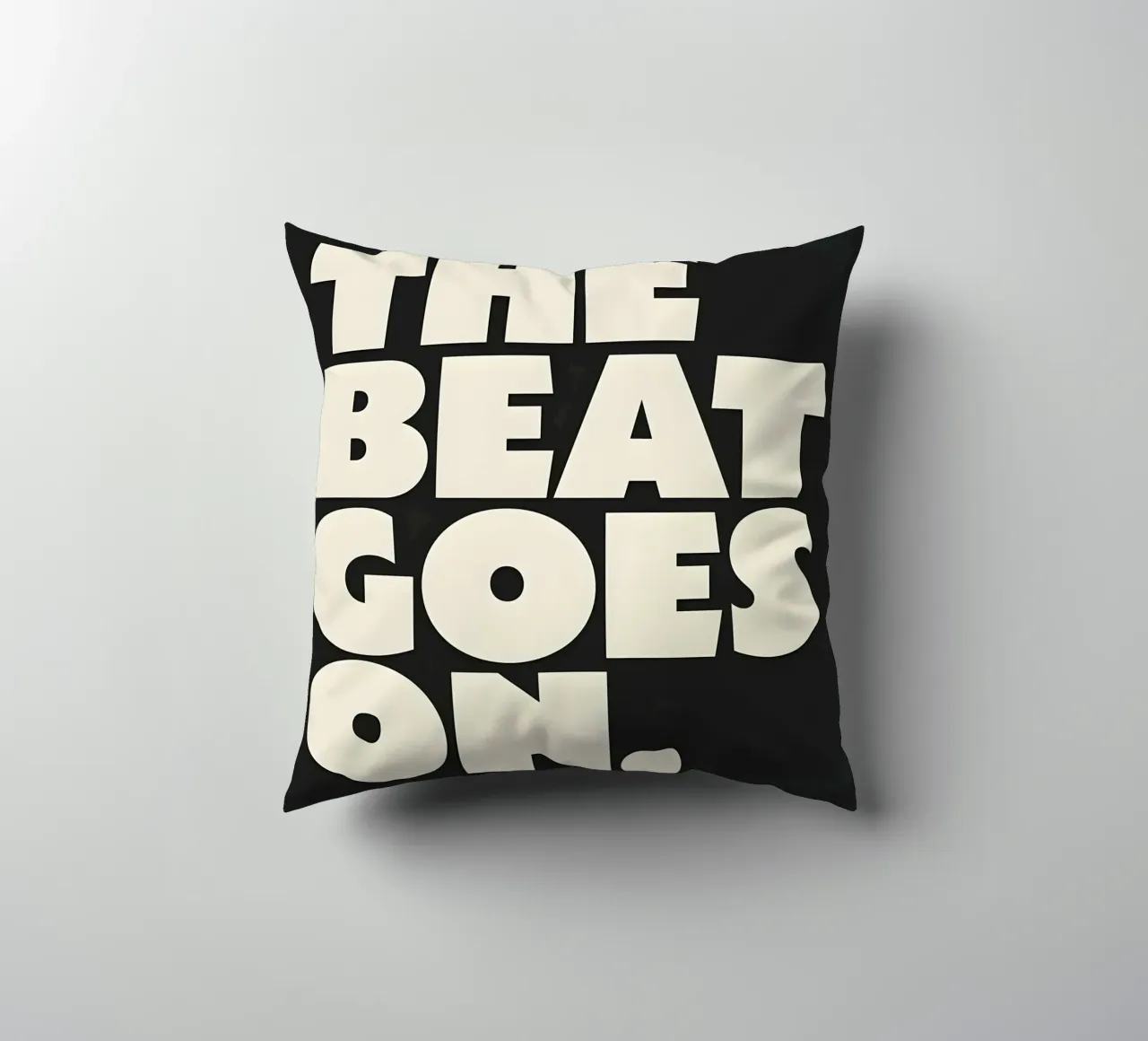"THE BEAT GOES ON." cuscino da Type & Tape