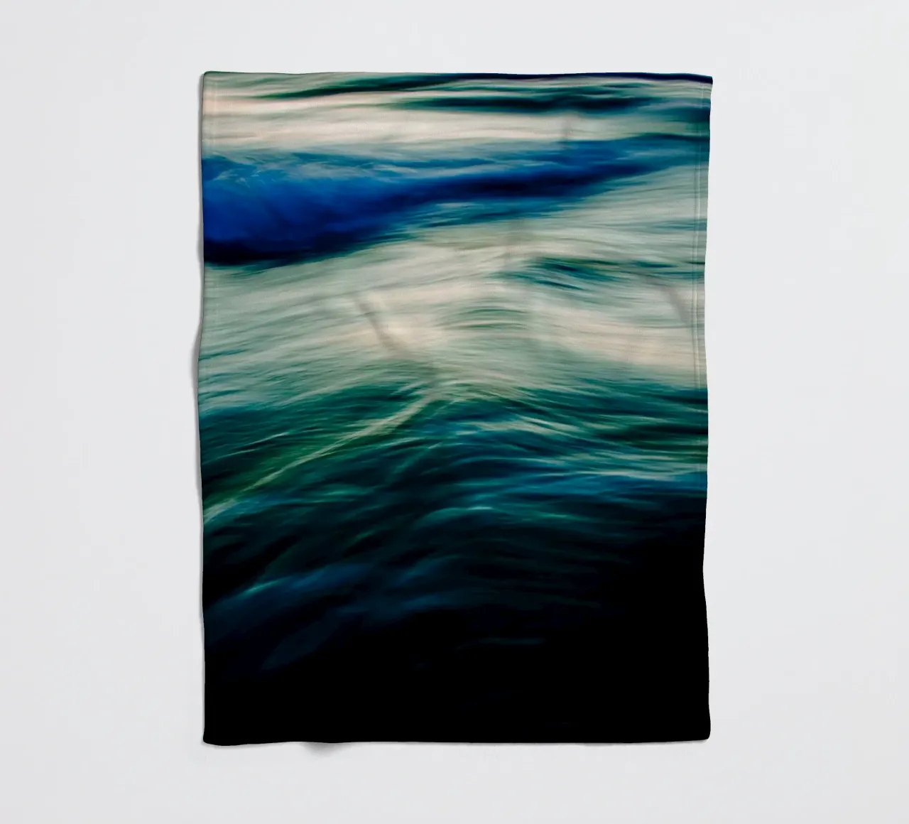 The Uniqueness of Waves V fleece blanket by Tal Paz-Fridman