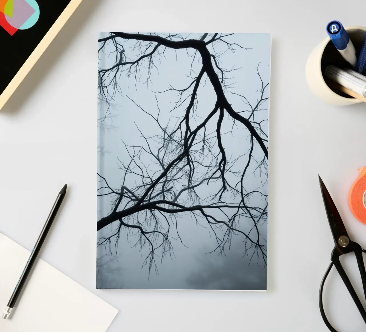 Bare Tree Branches Against Overcast Sky notebook by DesignDoodle