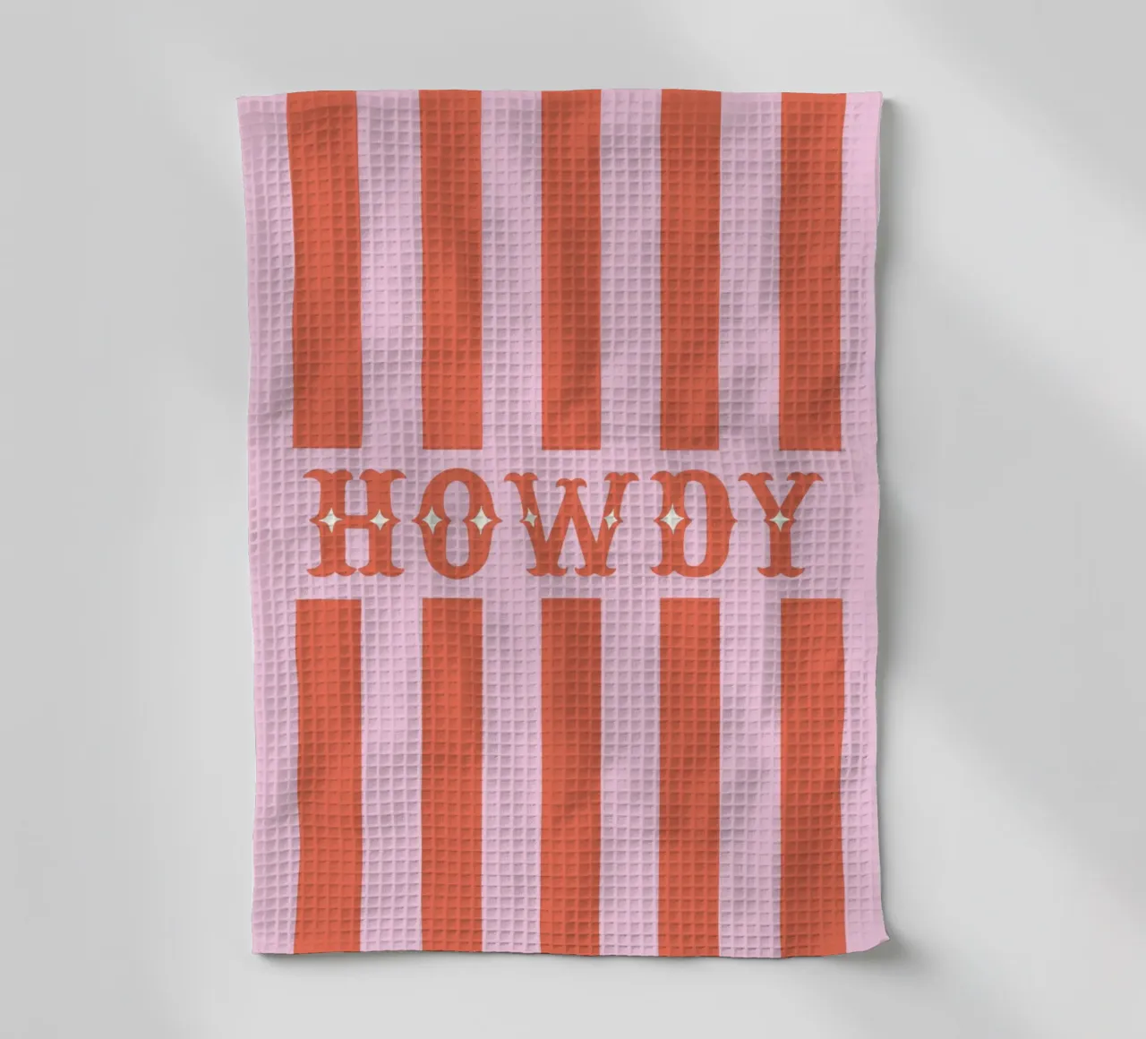 Howdy – Western Typography Print in Coral and Pink tea towel by Vivdesign