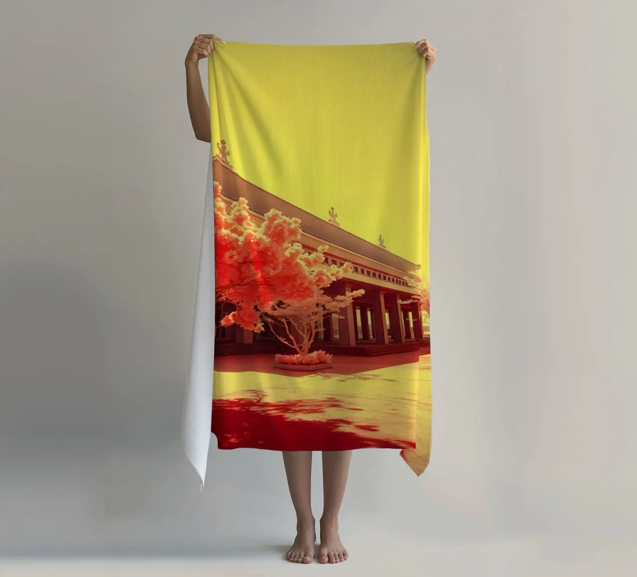 Building Facade with Trees in Red and Yellow Light beach towel by DesignDoodle