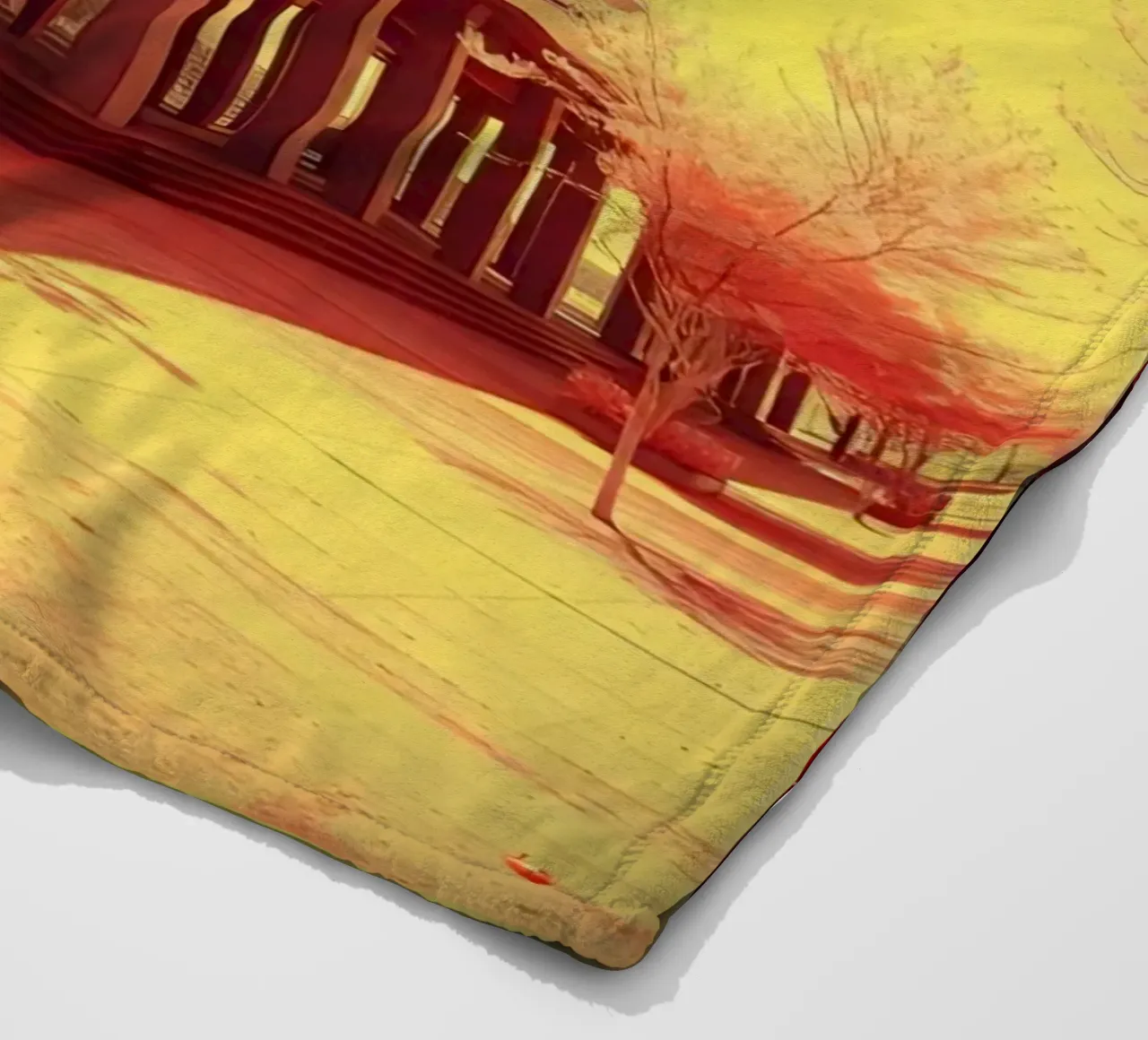 Building Facade with Trees in Red and Yellow Light fleece blanket by DesignDoodle