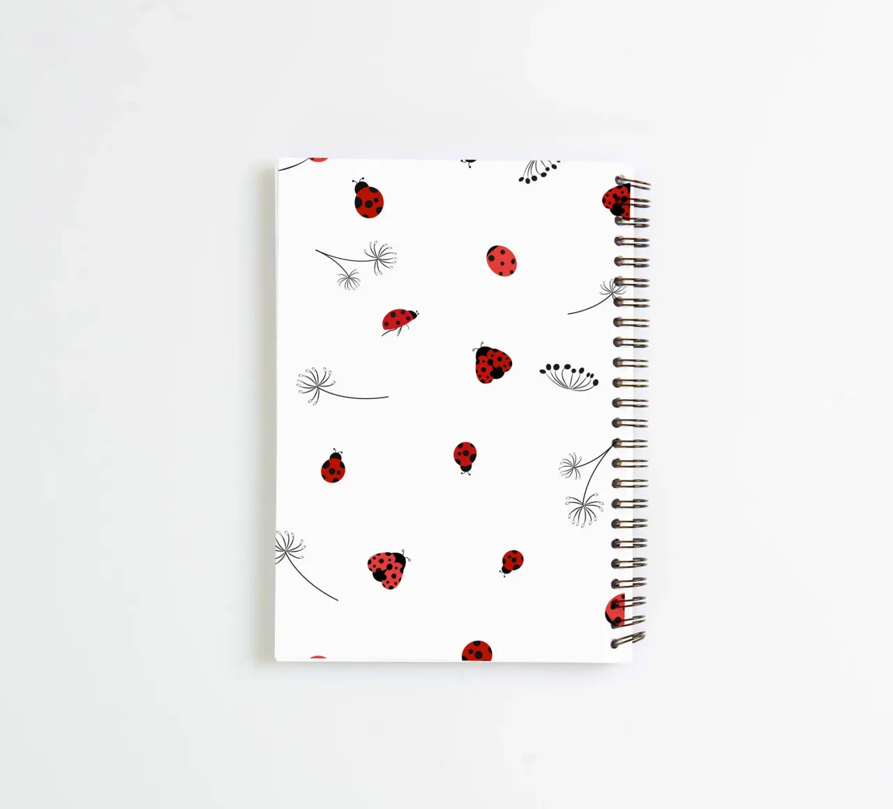 Lady bug and dandelion pattern spiral notebook by gulsengunel
