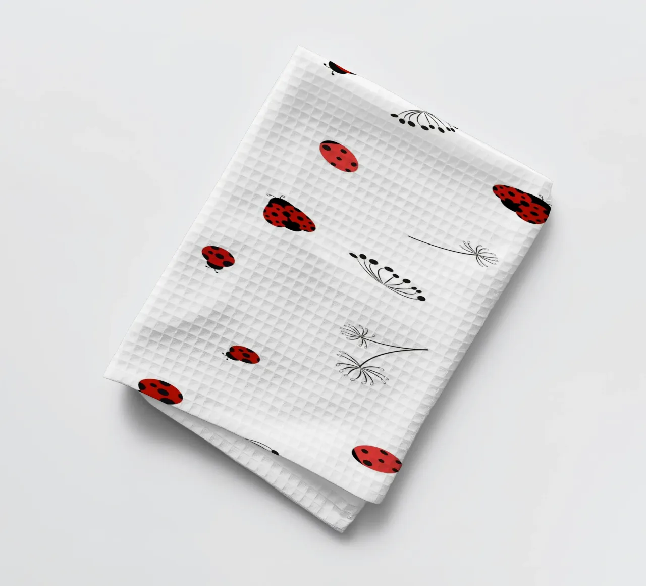 Lady bug and dandelion pattern tea towel by gulsengunel