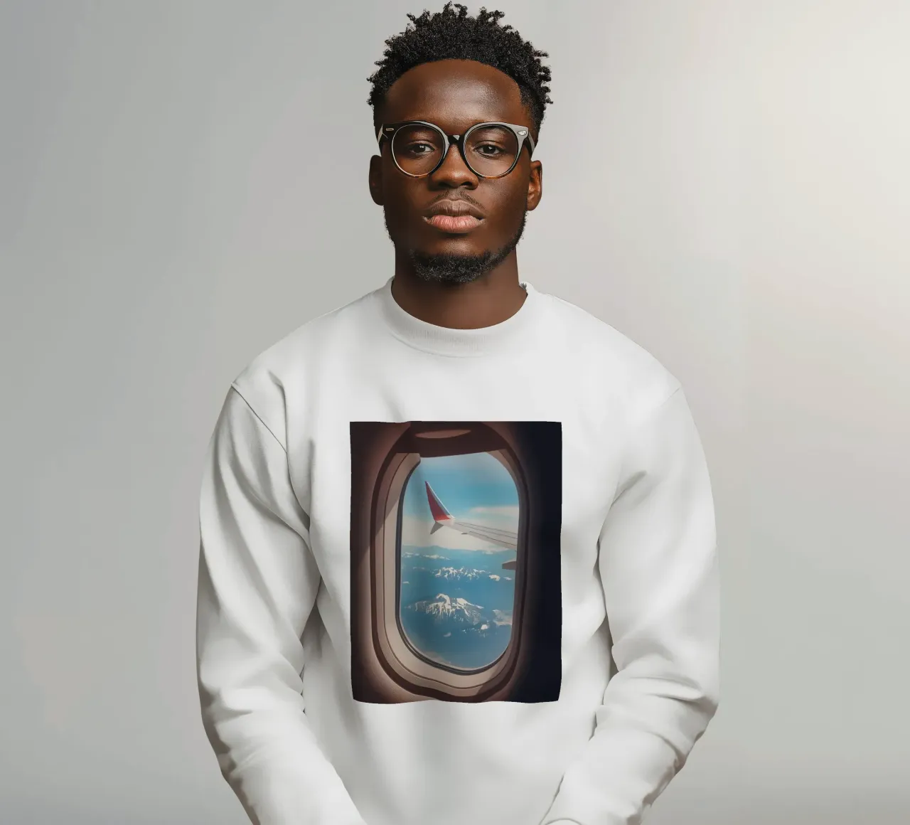 Vue d'un hublot d'avion sur une aile et des montagnes sweat de DesignDoodle