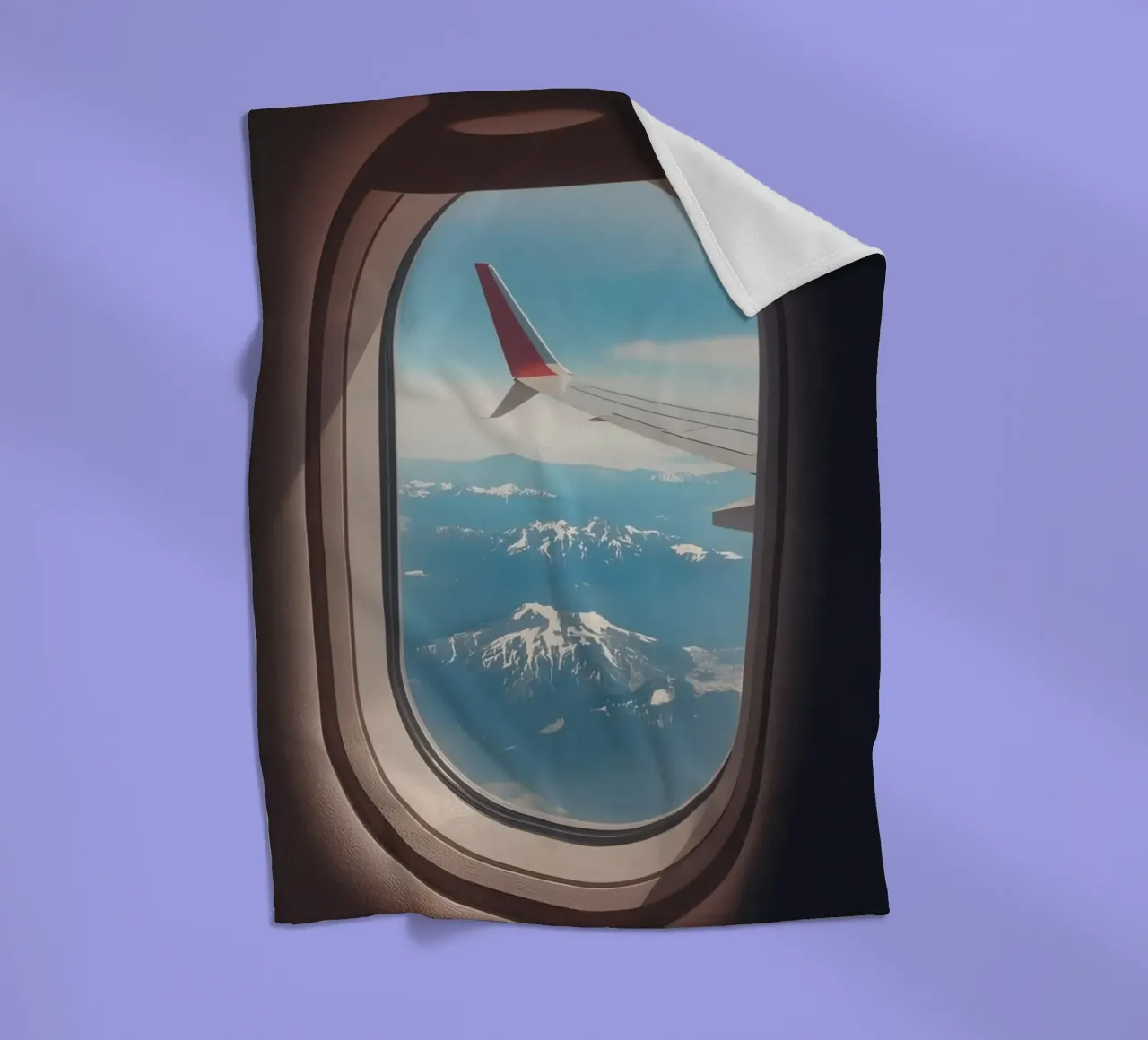 Vue d'un hublot d'avion sur une aile et des montagnes plaid polaire de DesignDoodle