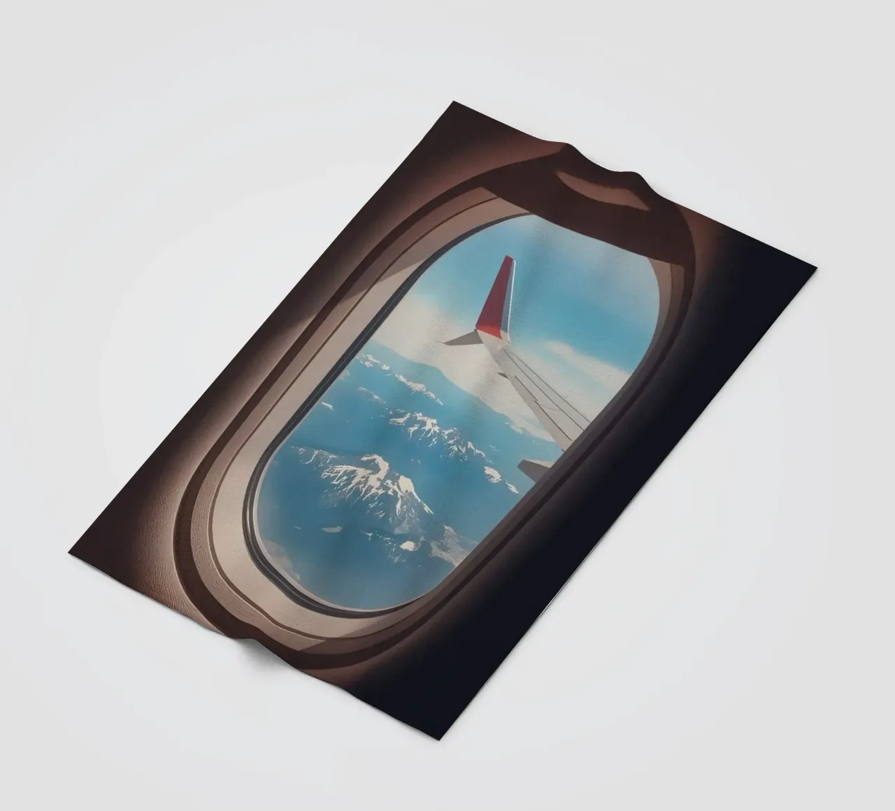 Vue d'un hublot d'avion sur une aile et des montagnes plaid polaire de DesignDoodle