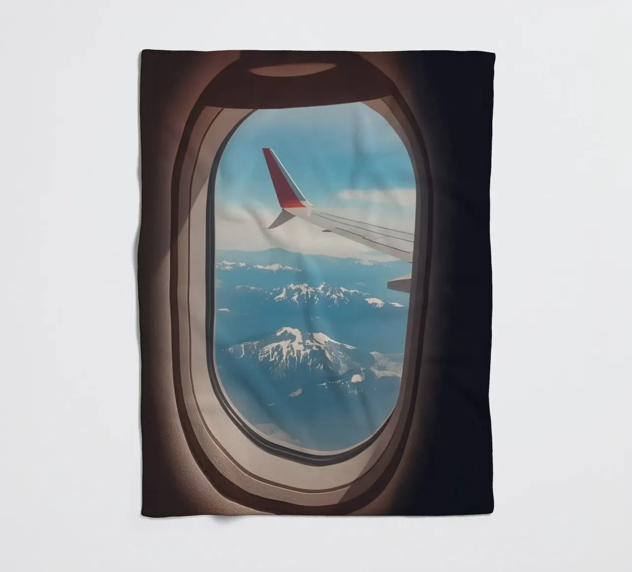Vue d'un hublot d'avion sur une aile et des montagnes plaid polaire de DesignDoodle