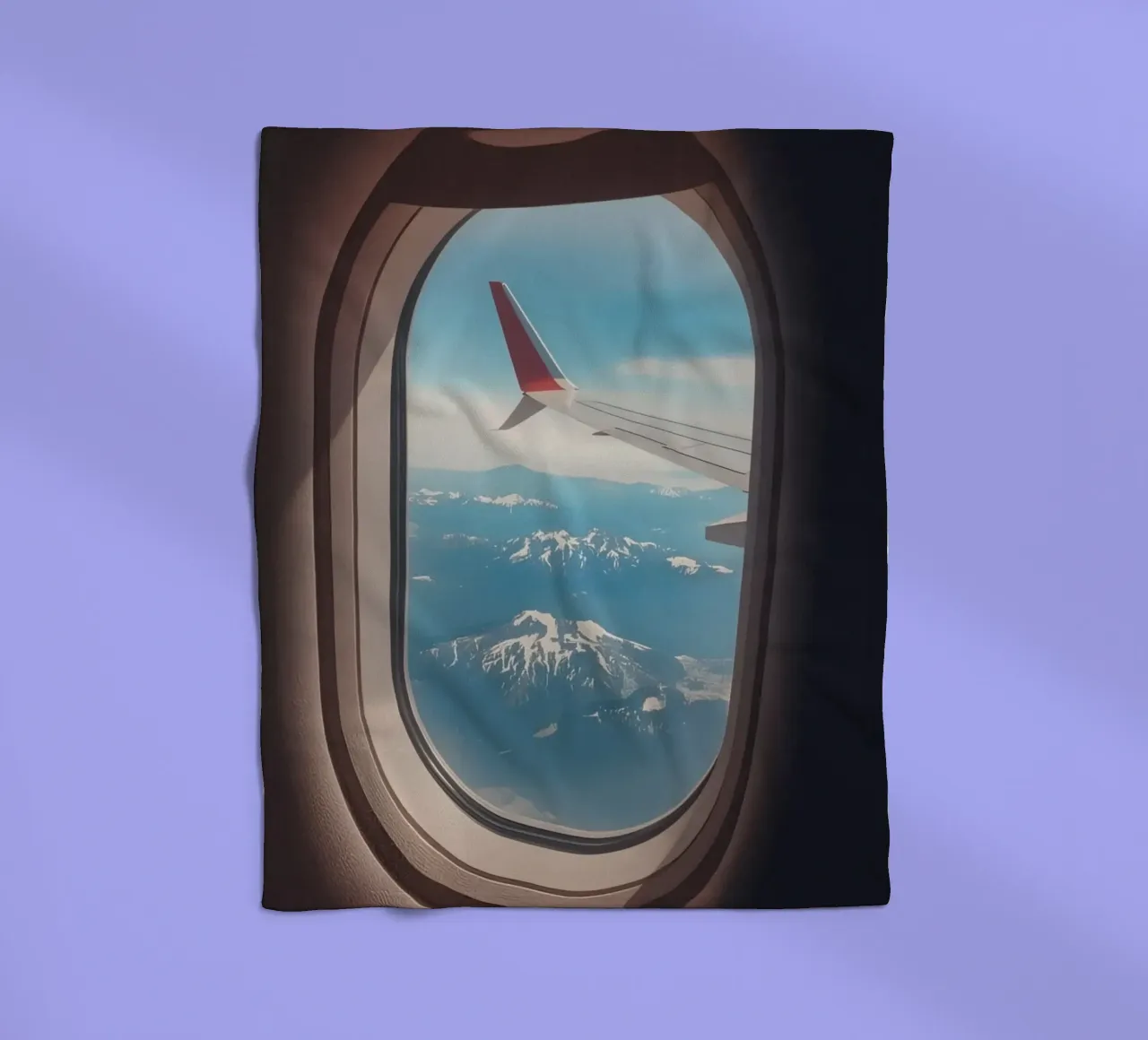 Vue d'un hublot d'avion sur une aile et des montagnes plaid polaire de DesignDoodle