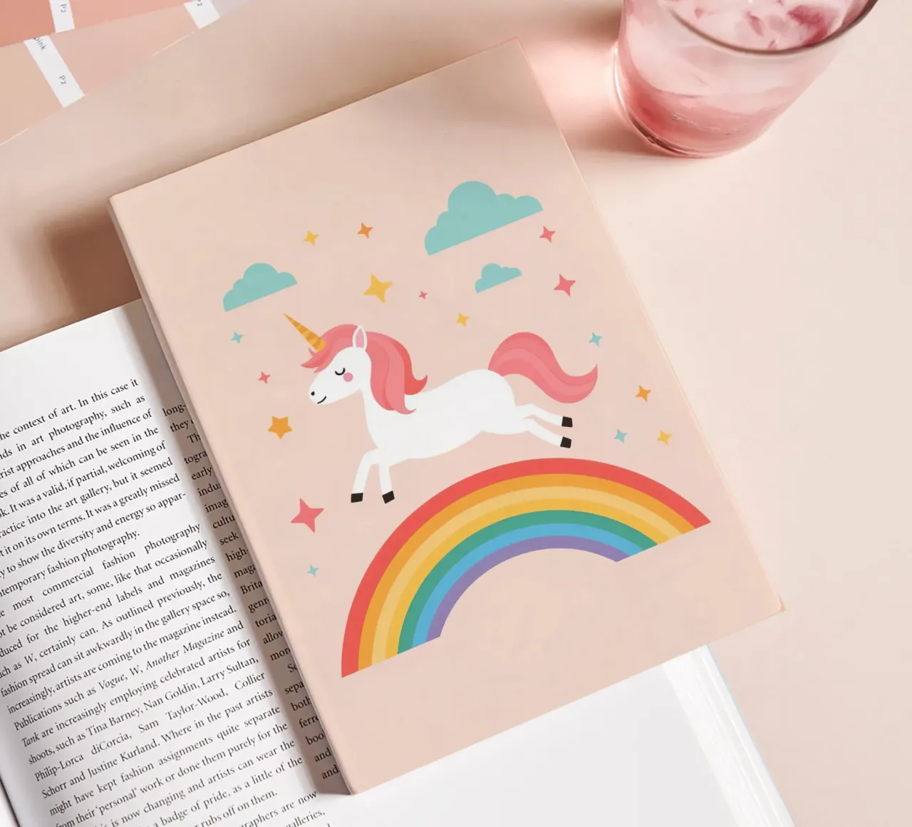 Cartoon Unicorn Leaping Over Rainbow with Stars and Clouds notebook by DesignDoodle