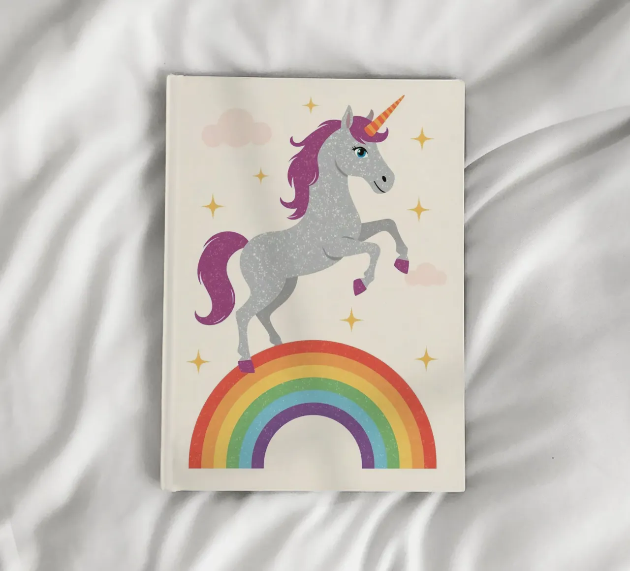 Cartoon Unicorn Leaping Over Rainbow with Stars and Clouds notebook by DesignDoodle