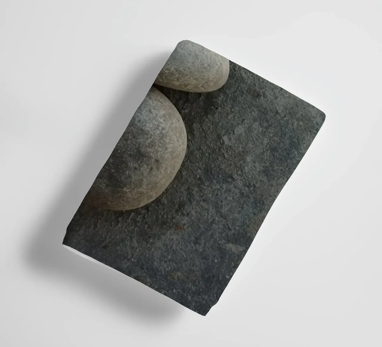 Five Gray Stones Stacked Vertically on Textured Surface towel by DesignDoodle