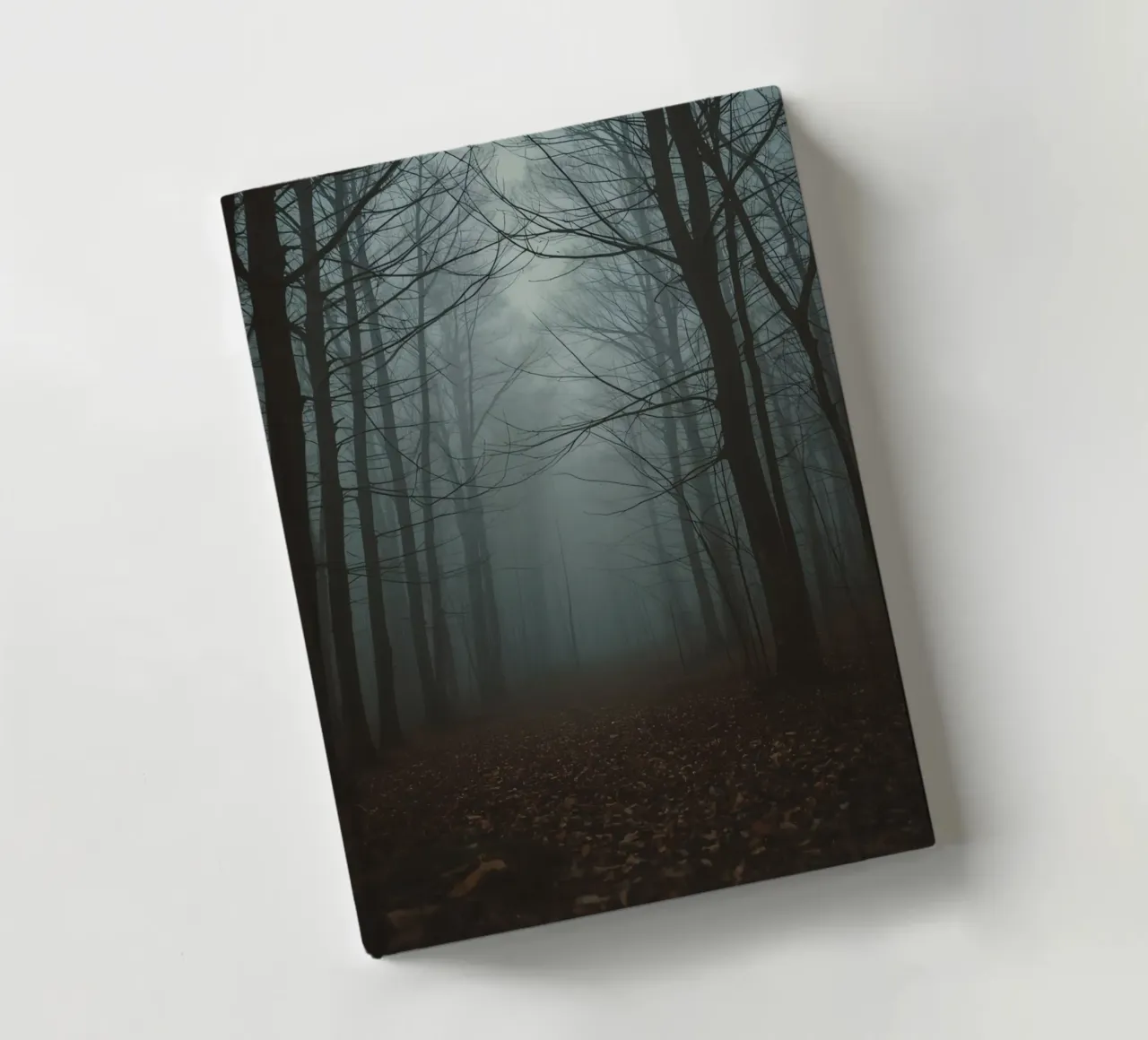 Foggy Forest Path with Bare Trees and Fallen Leaves notebook by DesignDoodle
