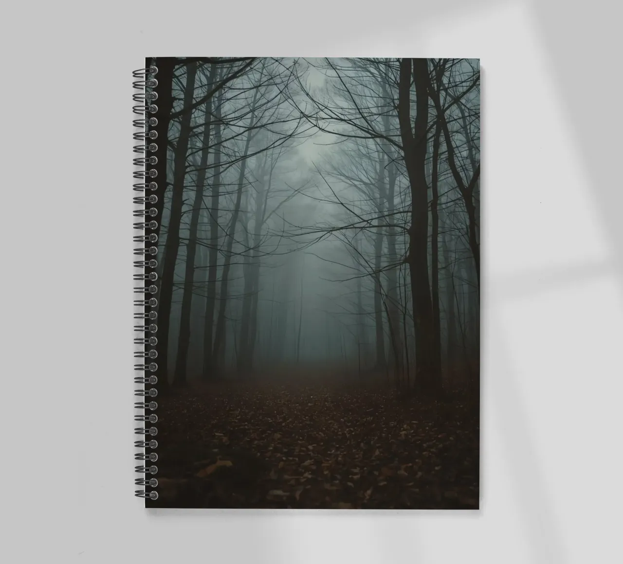 Foggy Forest Path with Bare Trees and Fallen Leaves spiral notebook by DesignDoodle