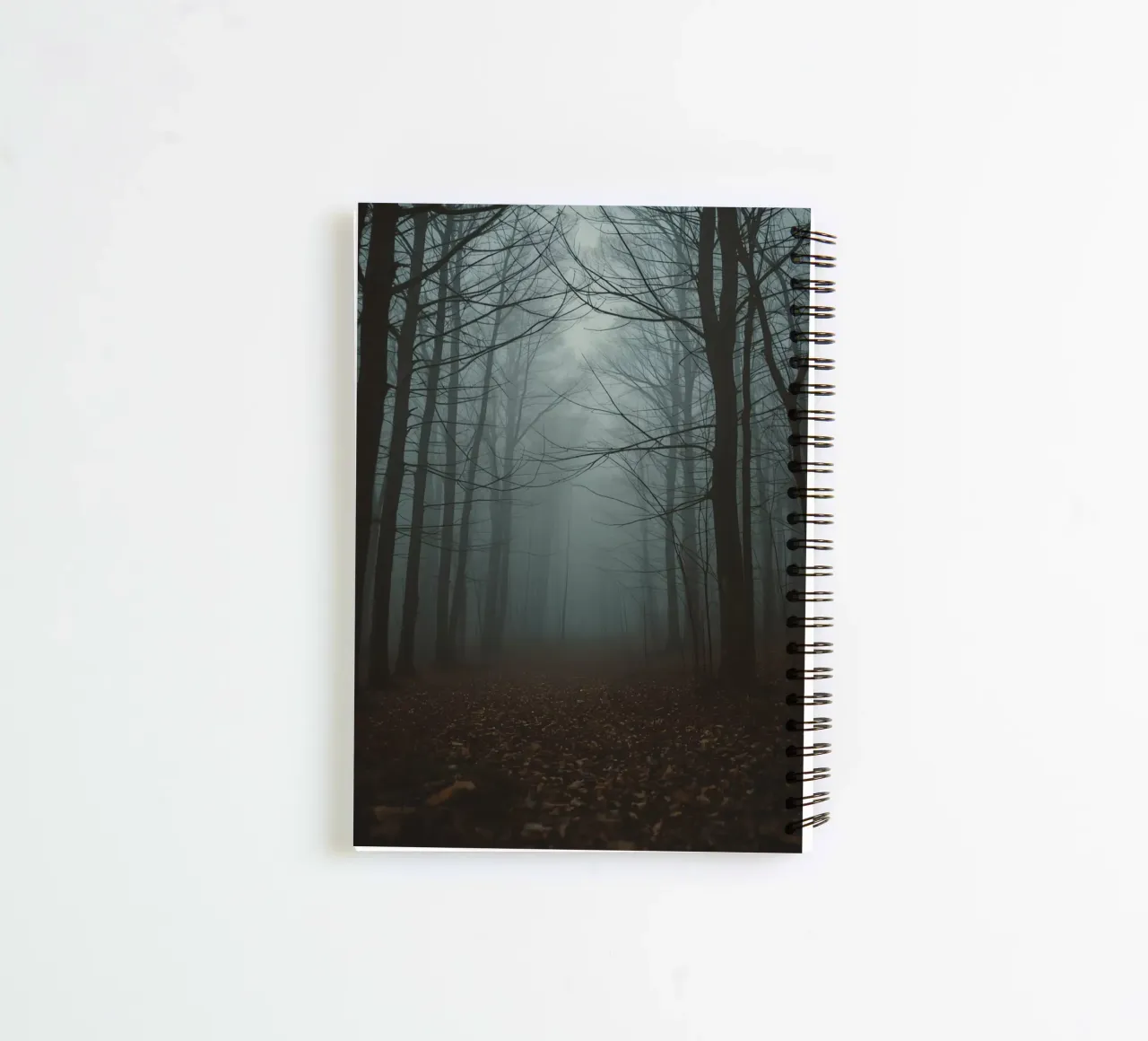 Foggy Forest Path with Bare Trees and Fallen Leaves spiral notebook by DesignDoodle