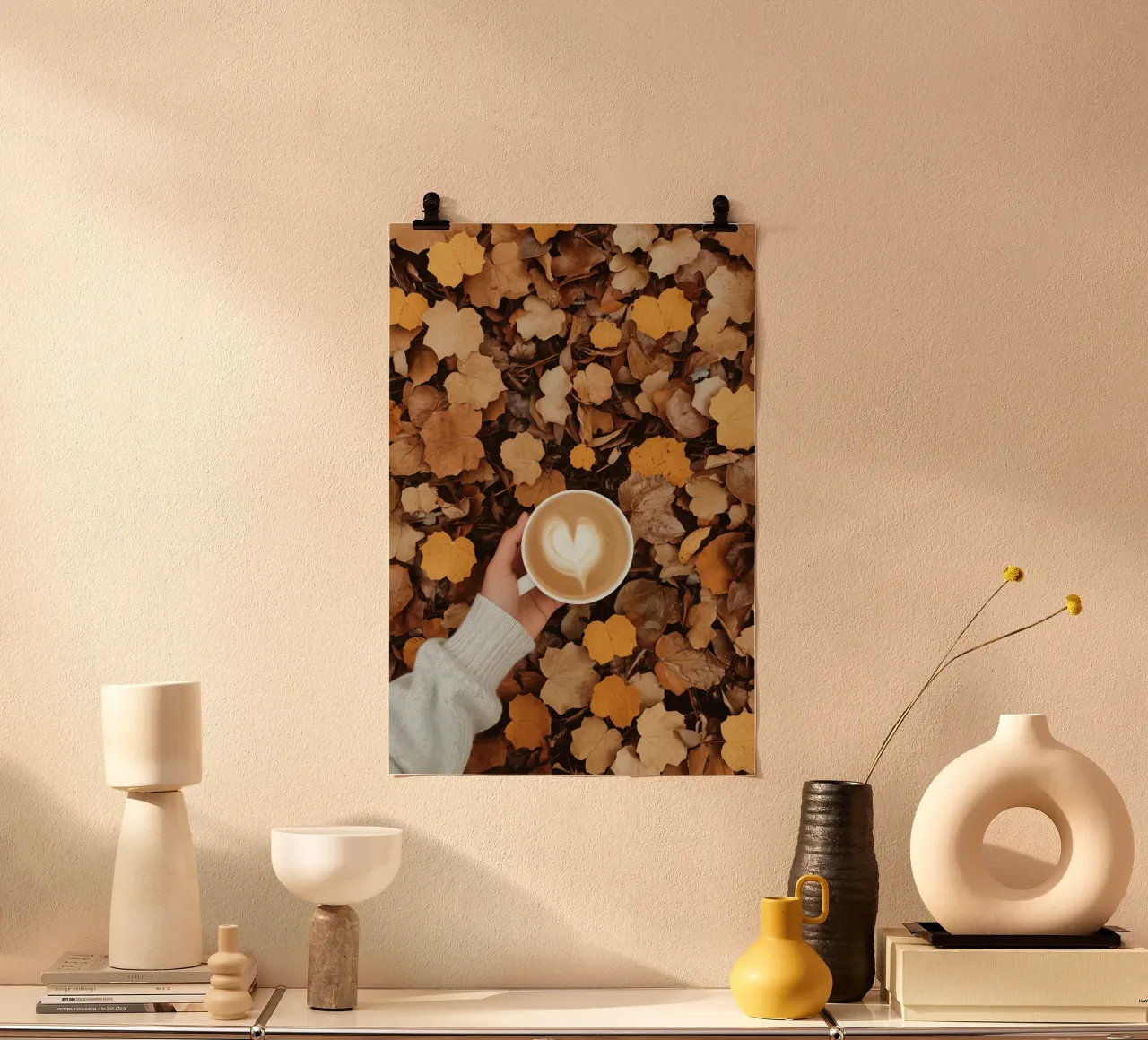Latte with Heart Art on Autumn Leaves Held by Hand poster by DesignDoodle