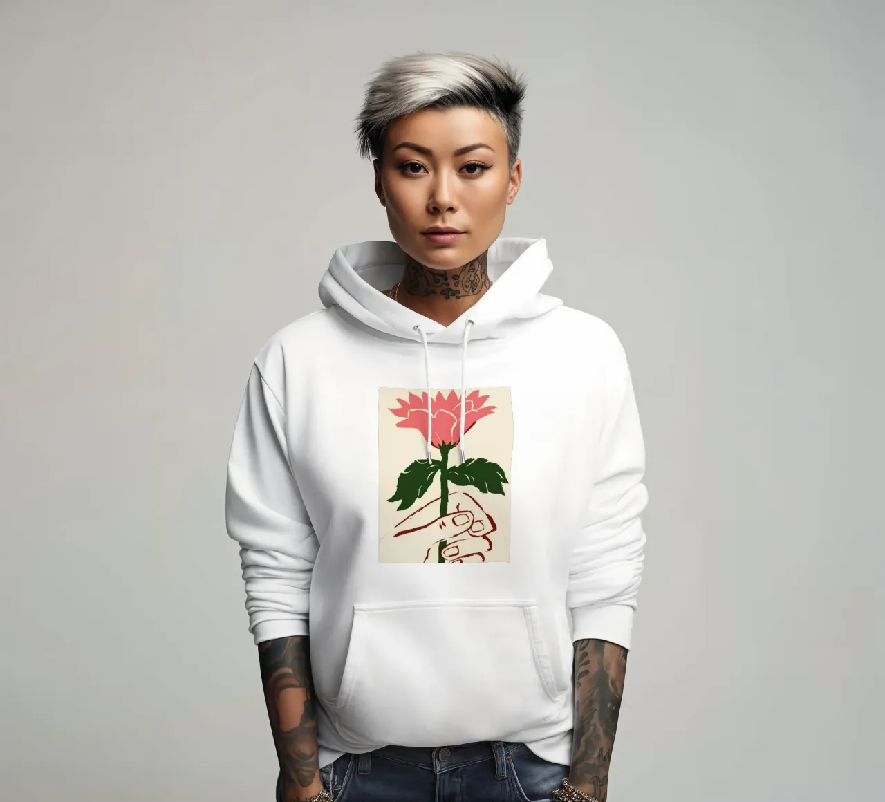 Mano che tiene un fiore rosa felpa con cappuccio da Lyra Glaze