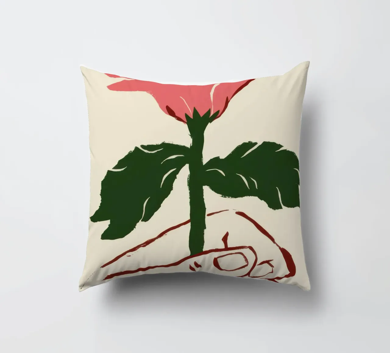Mano che tiene un fiore rosa cuscino da Lyra Glaze