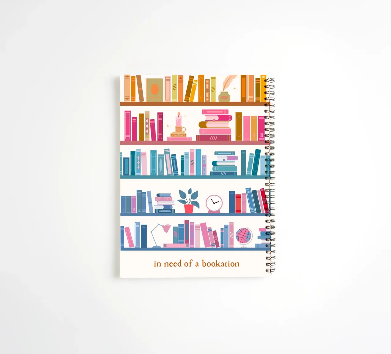 "In Need of a Bookation" - Colorful Bookshelf Art Print spiral notebook by vintagepod