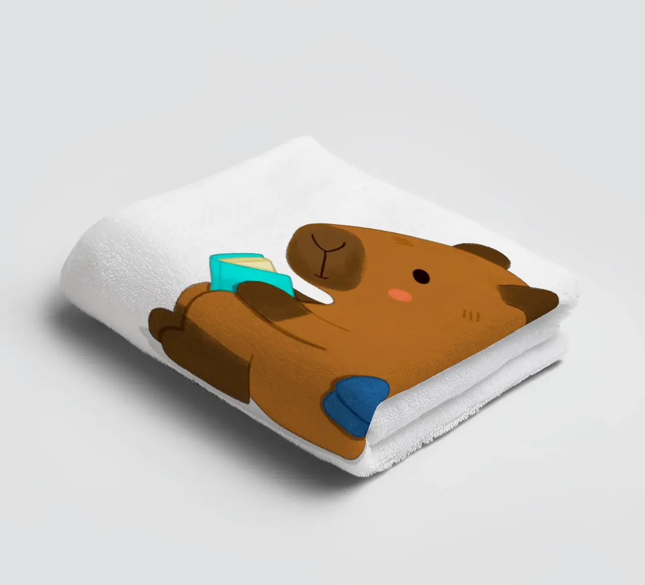 Capybara and Bird reading books towel by julianamotzko