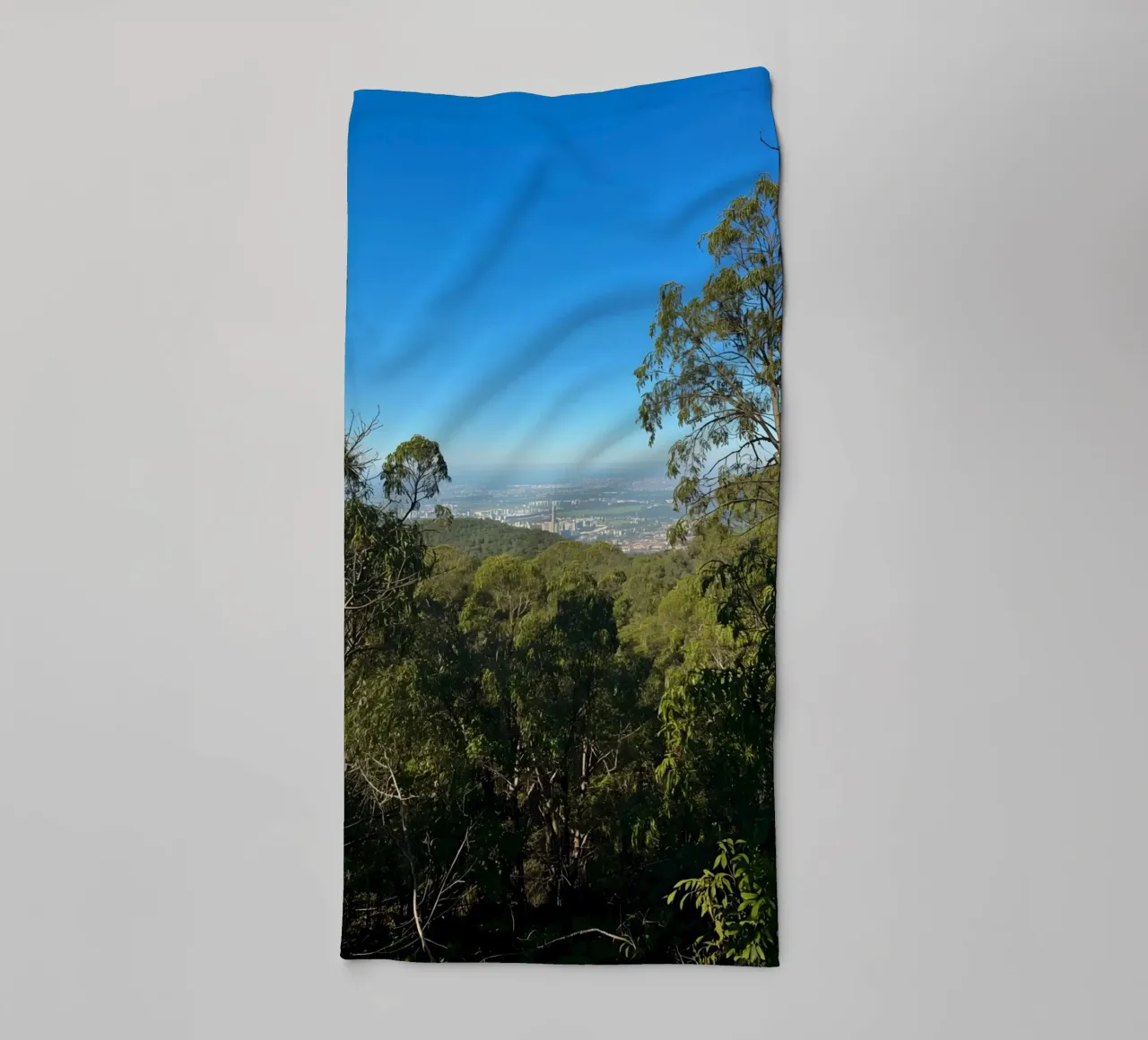 Cityscape View Through Trees towel by DesignDoodle