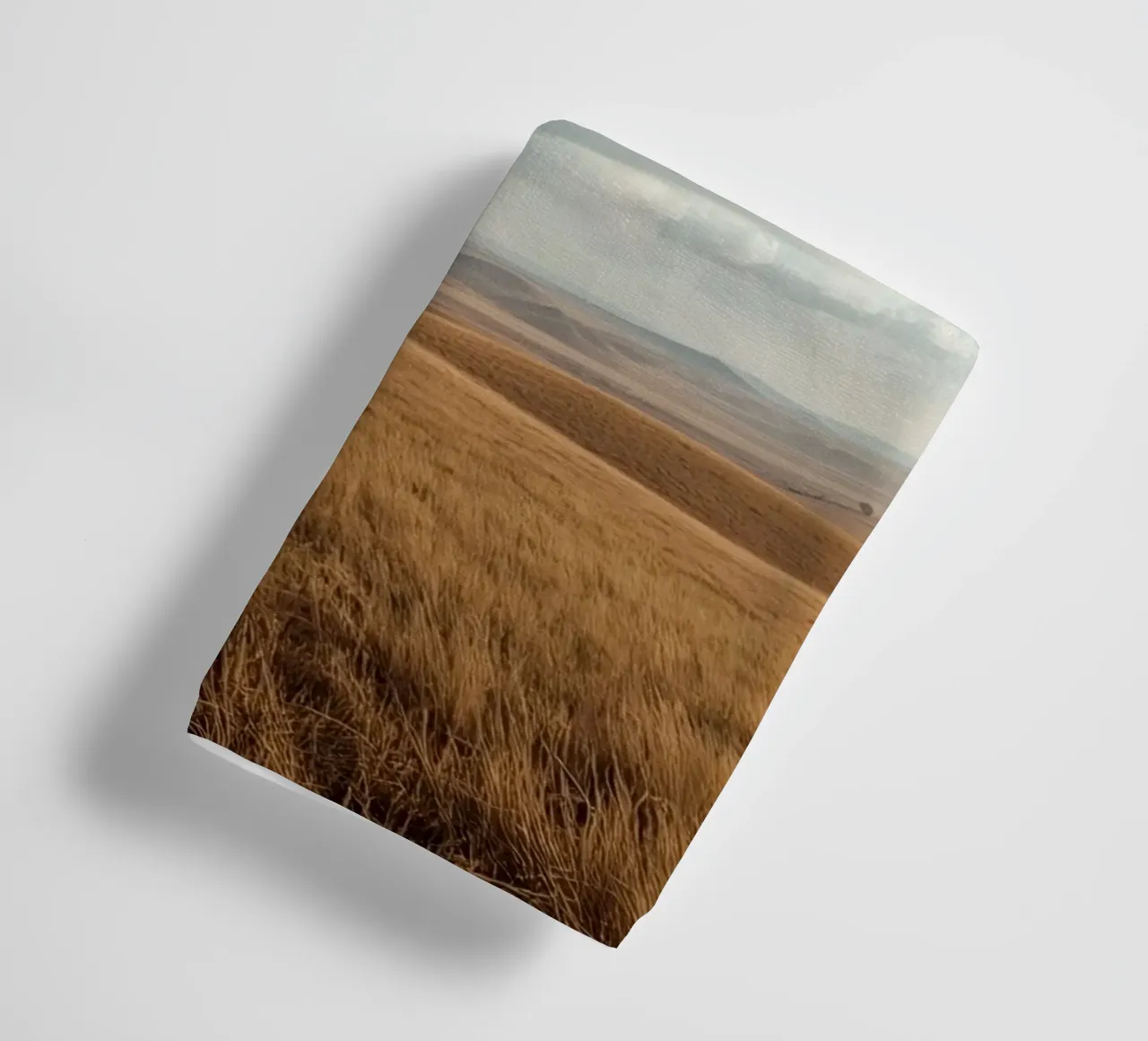 Grass Field with Tree under Cloudy Blue Sky towel by DesignDoodle