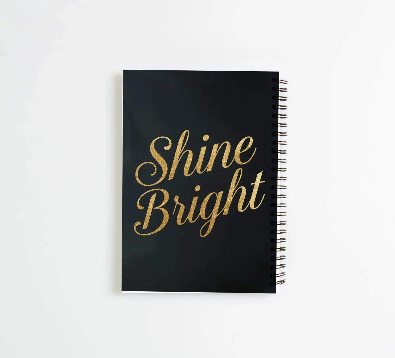 Tilted Golden "Shine Bright" Script on Dark Background spiral notebook by DesignDoodle