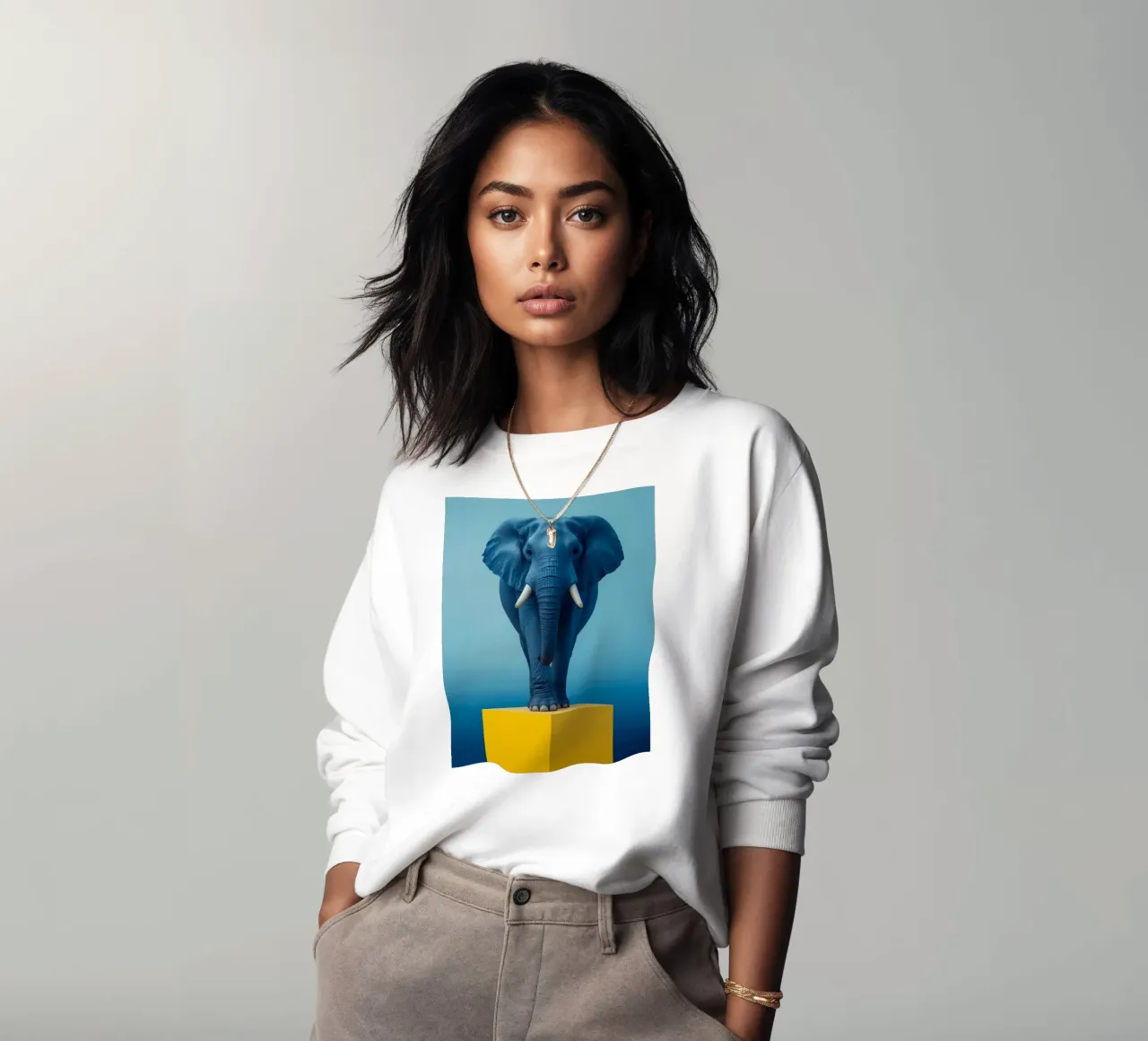 Eléphant bleu debout sur un cube jaune sweat de DesignDoodle