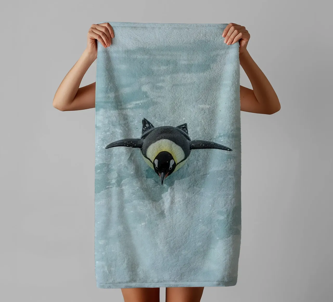 Emperor Penguin Skating in Ice Water towel by DesignDoodle