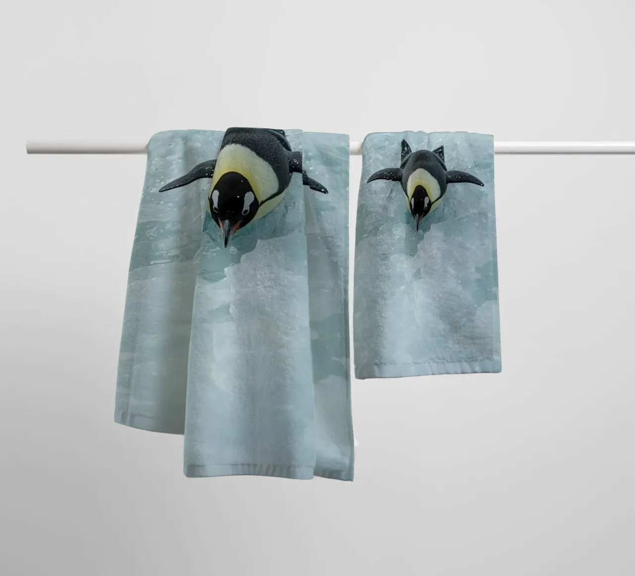 Emperor Penguin Skating in Ice Water towel by DesignDoodle
