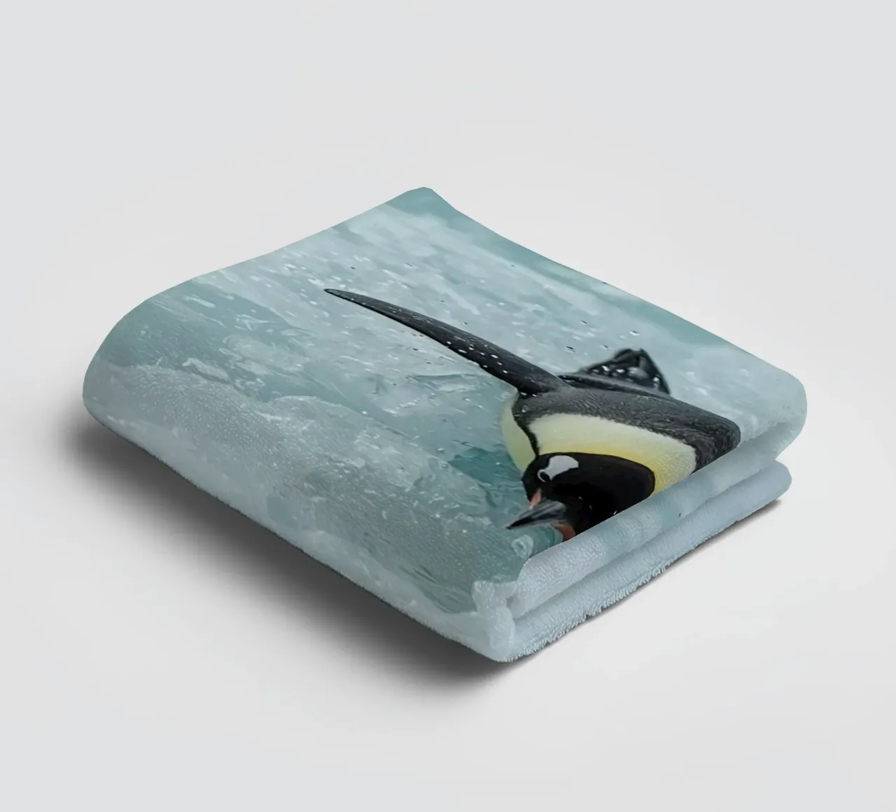 Emperor Penguin Skating in Ice Water towel by DesignDoodle