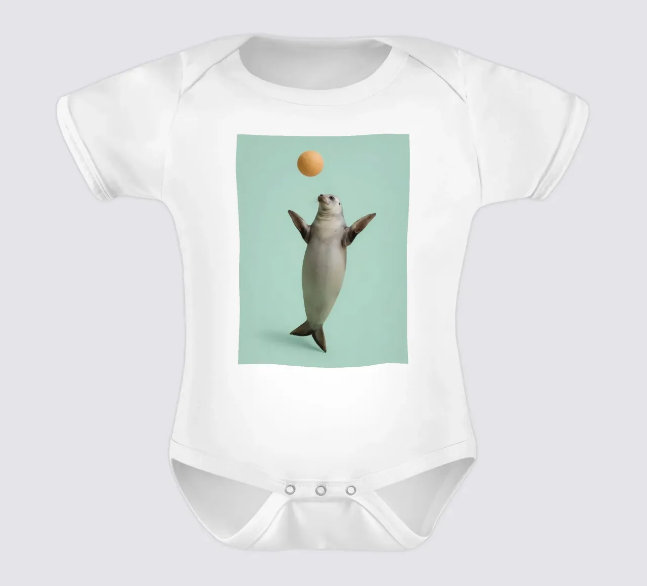 Seal Balancing with Ball on Green Background short-sleeve baby romper by DesignDoodle