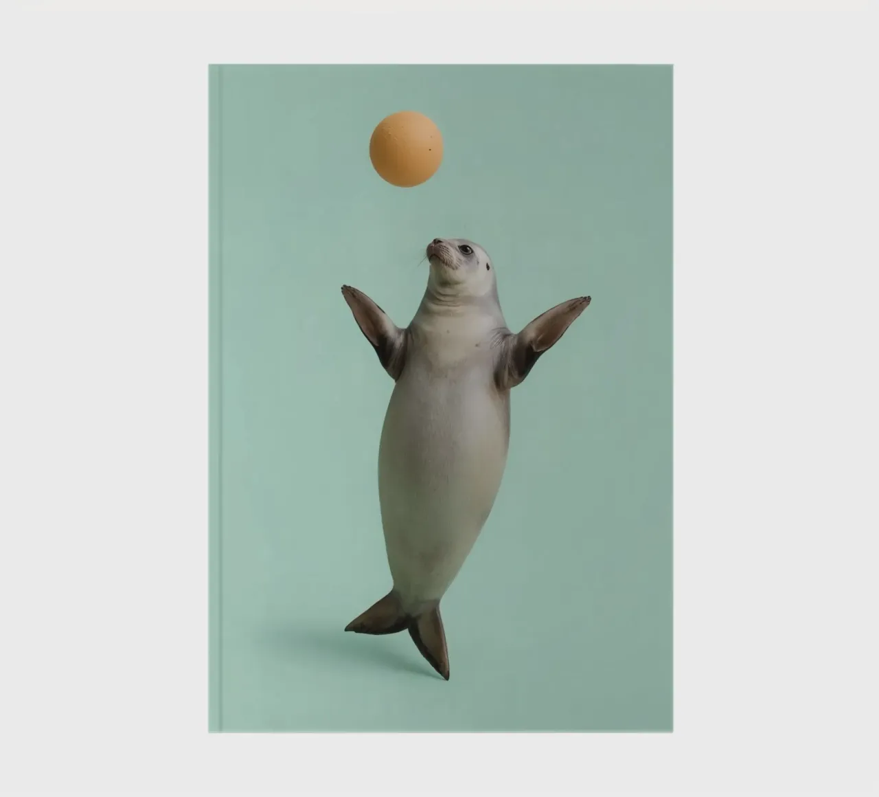 Seal Balancing with Ball on Green Background notebook by DesignDoodle