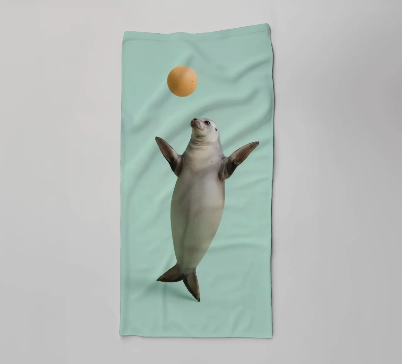 Seal Balancing with Ball on Green Background towel by DesignDoodle