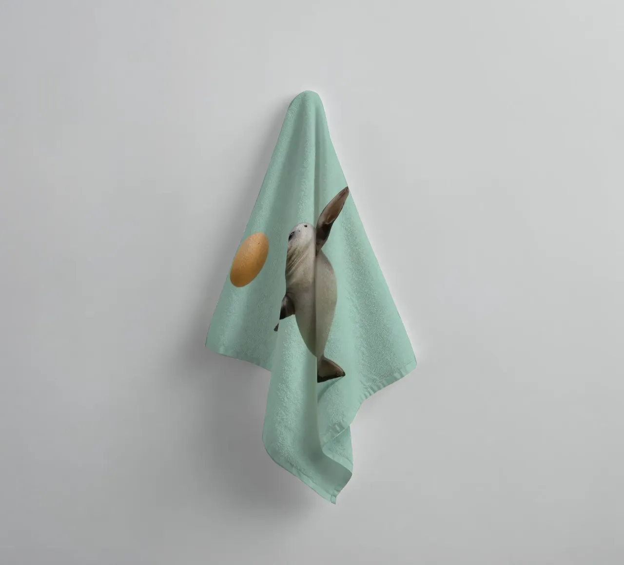 Seal Balancing with Ball on Green Background towel by DesignDoodle