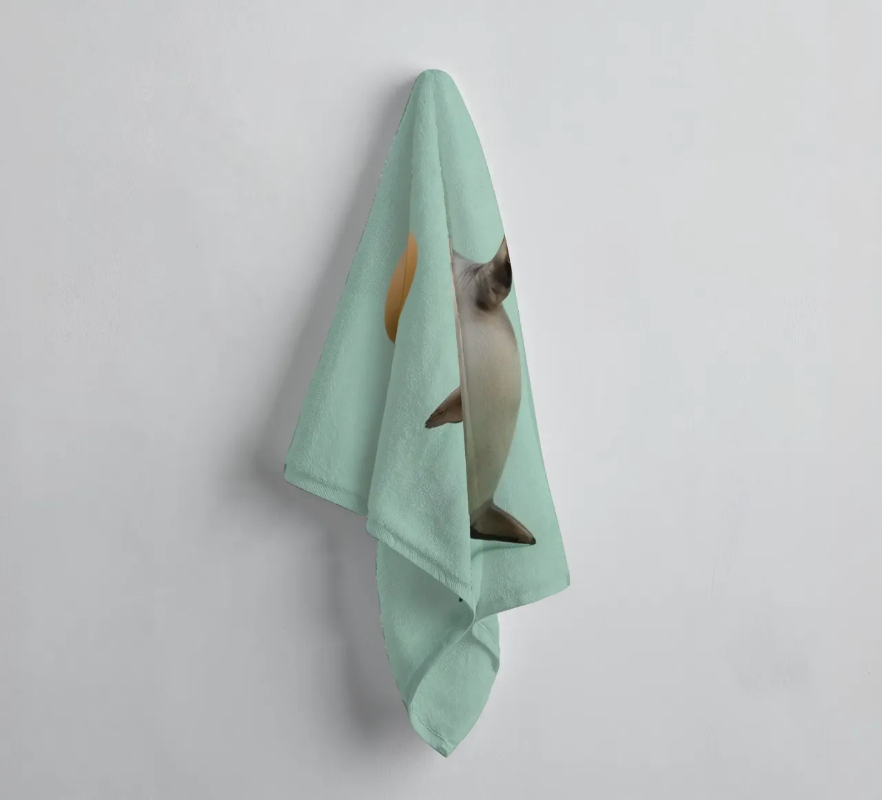 Seal Balancing with Ball on Green Background towel by DesignDoodle