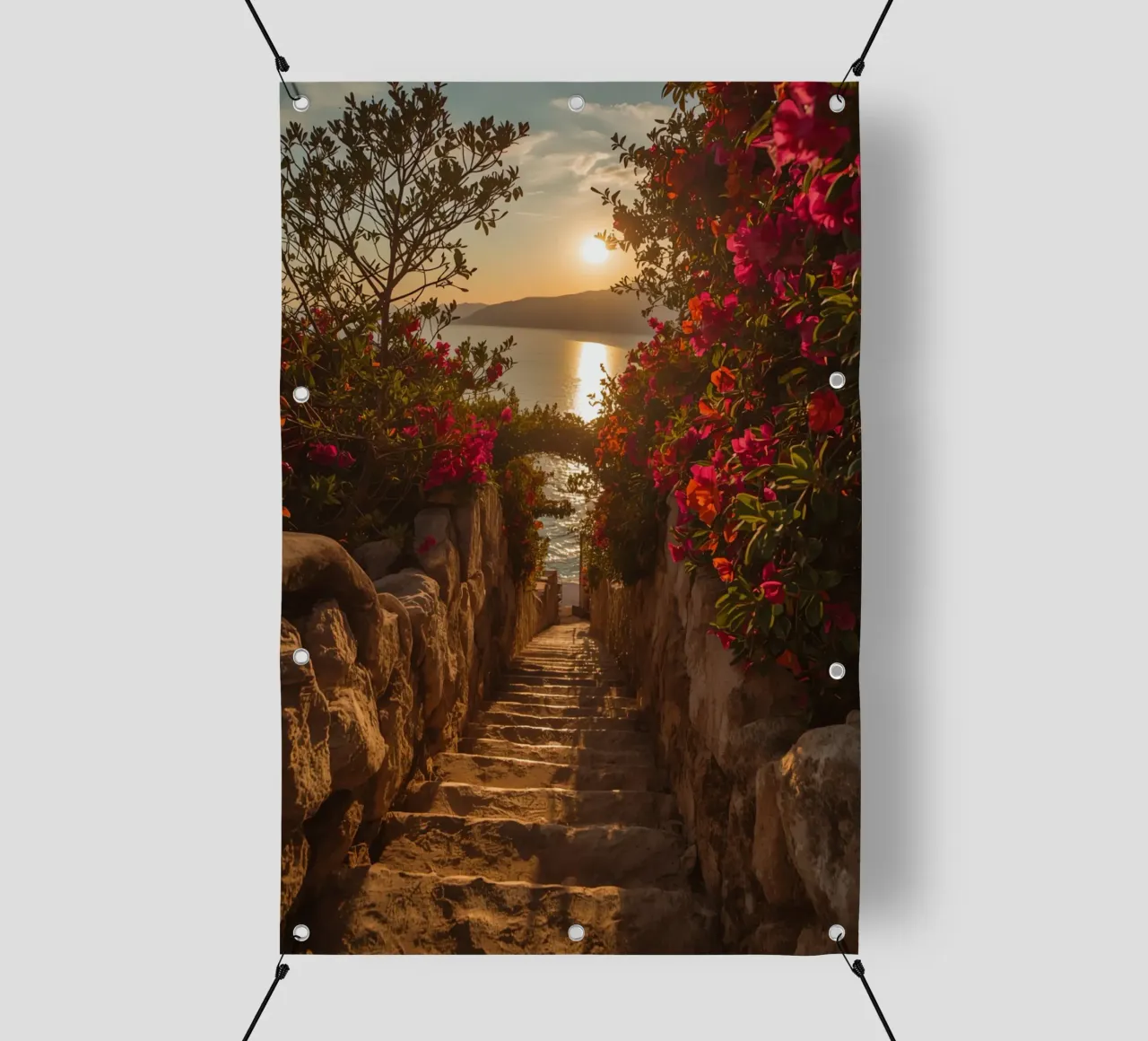 Scala in pietra con fiori che conduce alla vista dell'oceano al tramonto telo in pvc da DesignDoodle