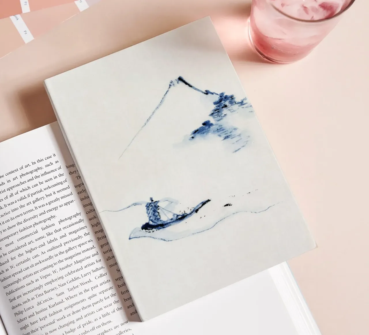 A person in a small boat on a river with Mount Fuji diario da vintageshop