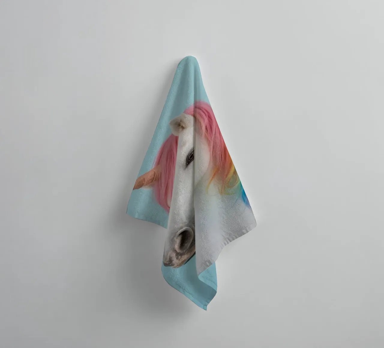 Unicorn with Rainbow Mane and Light Blue Background towel by DesignDoodle