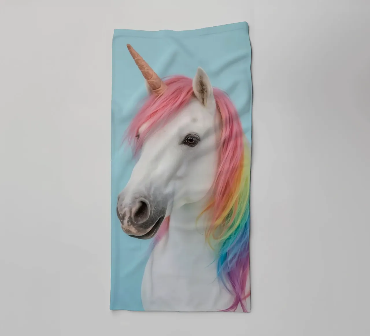 Unicorn with Rainbow Mane and Light Blue Background towel by DesignDoodle