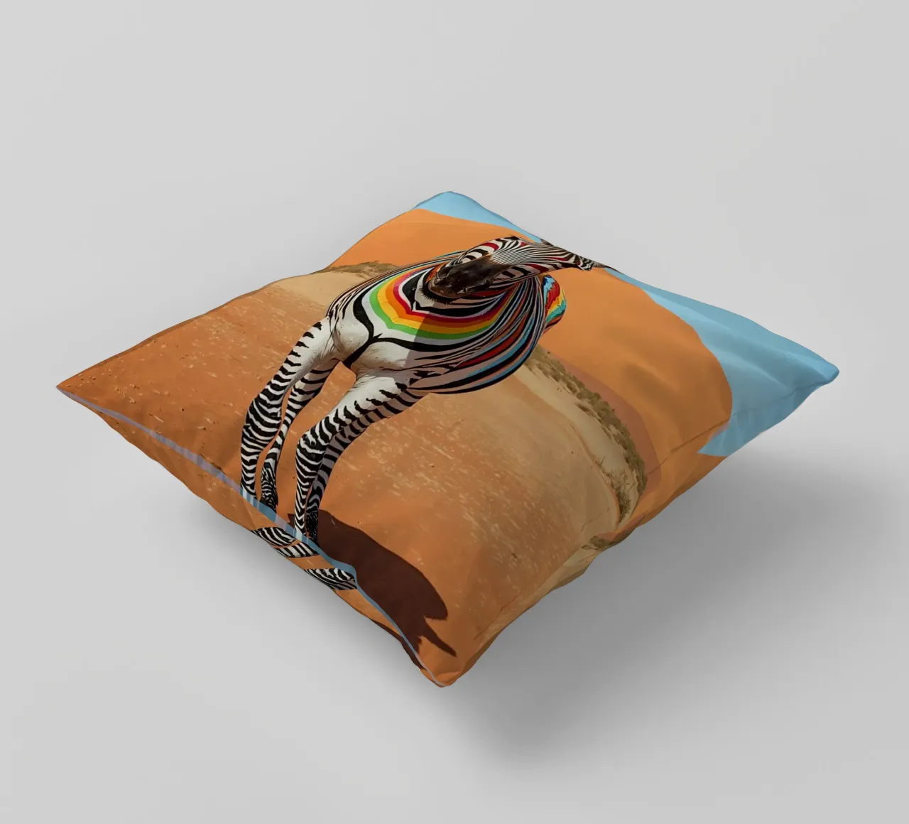 Zebra a strisce arcobaleno in un paesaggio desertico cuscino da DesignDoodle