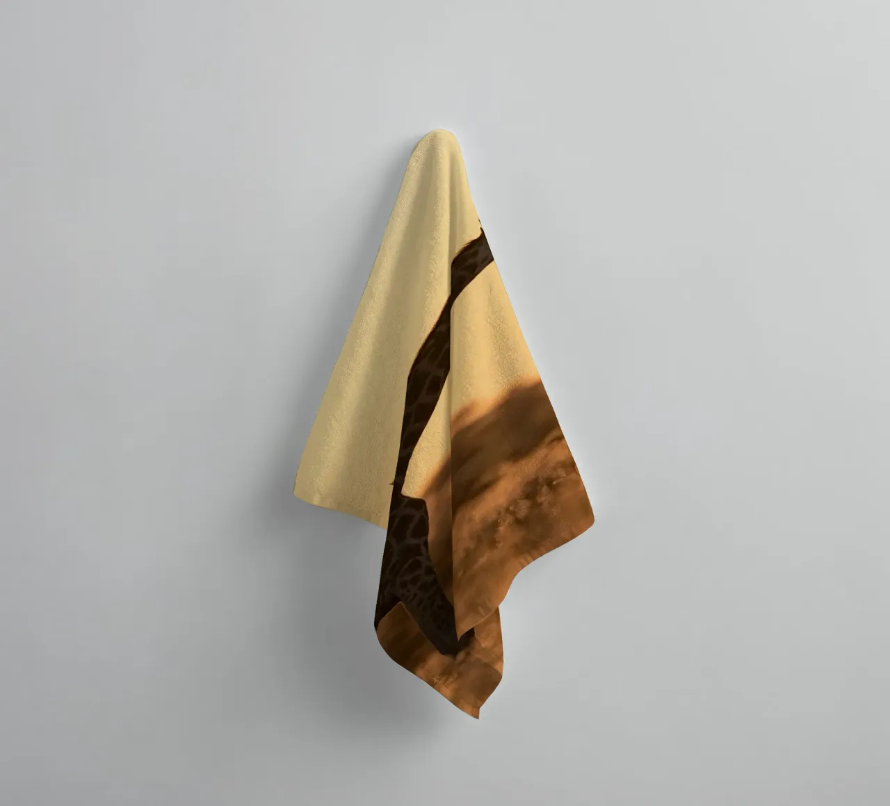 A giraffe standing on the meadow in the afternoon towel by Earthly Visions