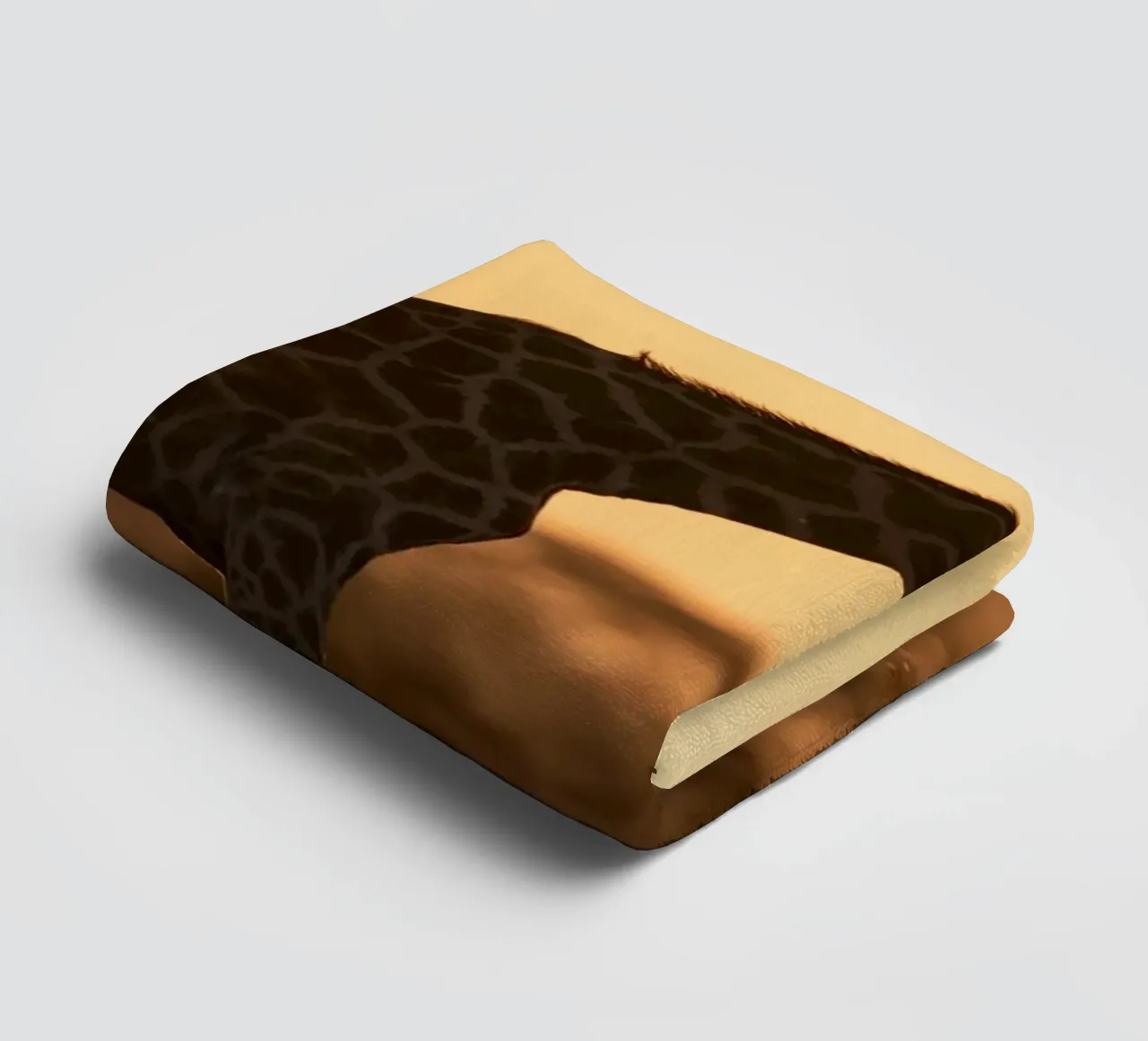 A giraffe standing on the meadow in the afternoon towel by Earthly Visions