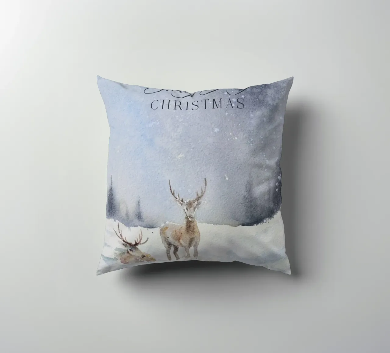 Renne in un bosco invernale con la scritta Have a Holly Jolly Chr cuscino da Studio Vibe