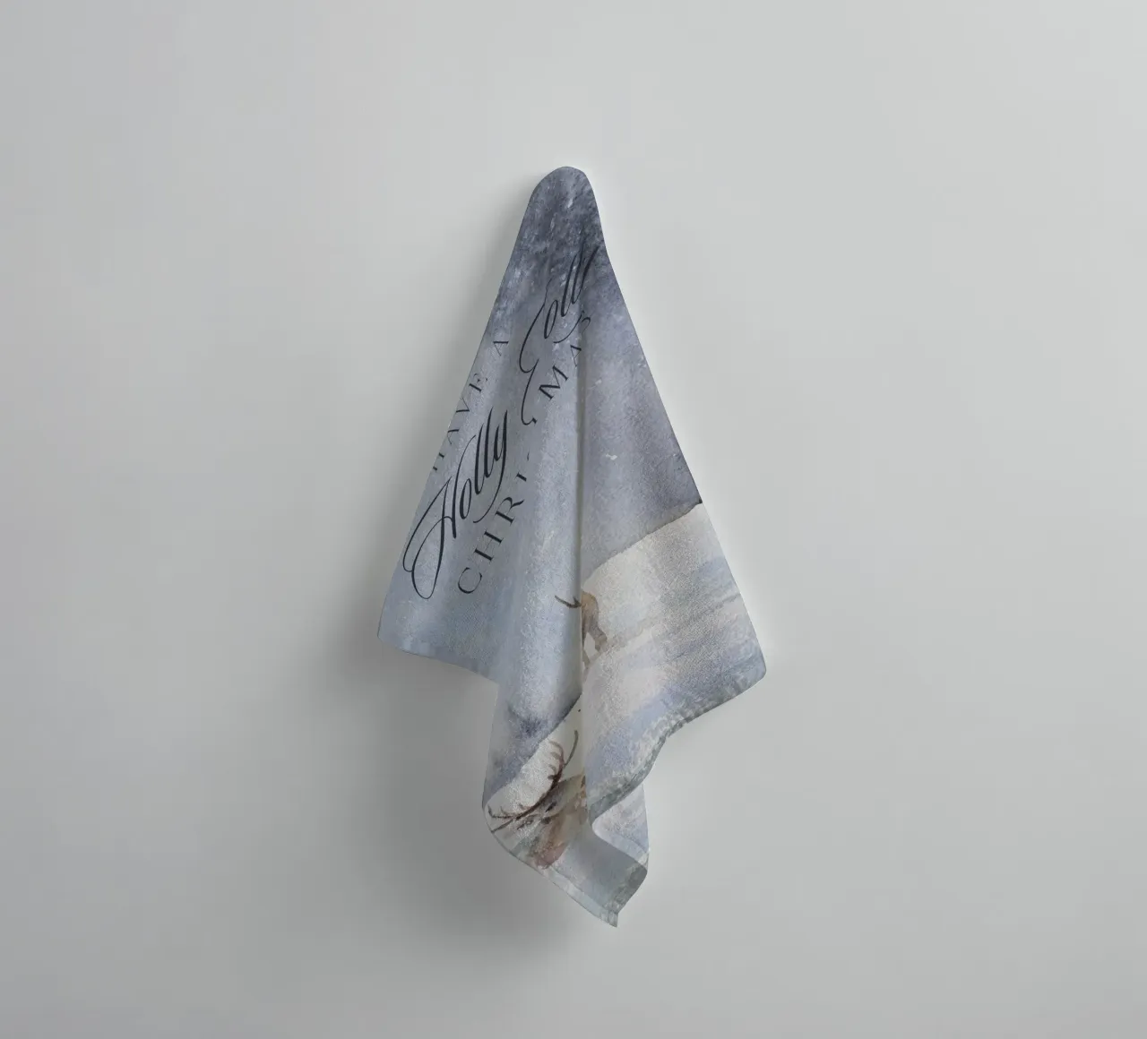 Reindeer in a winter forest with the lettering Have a Holly Jolly Chr towel by Studio Vibe
