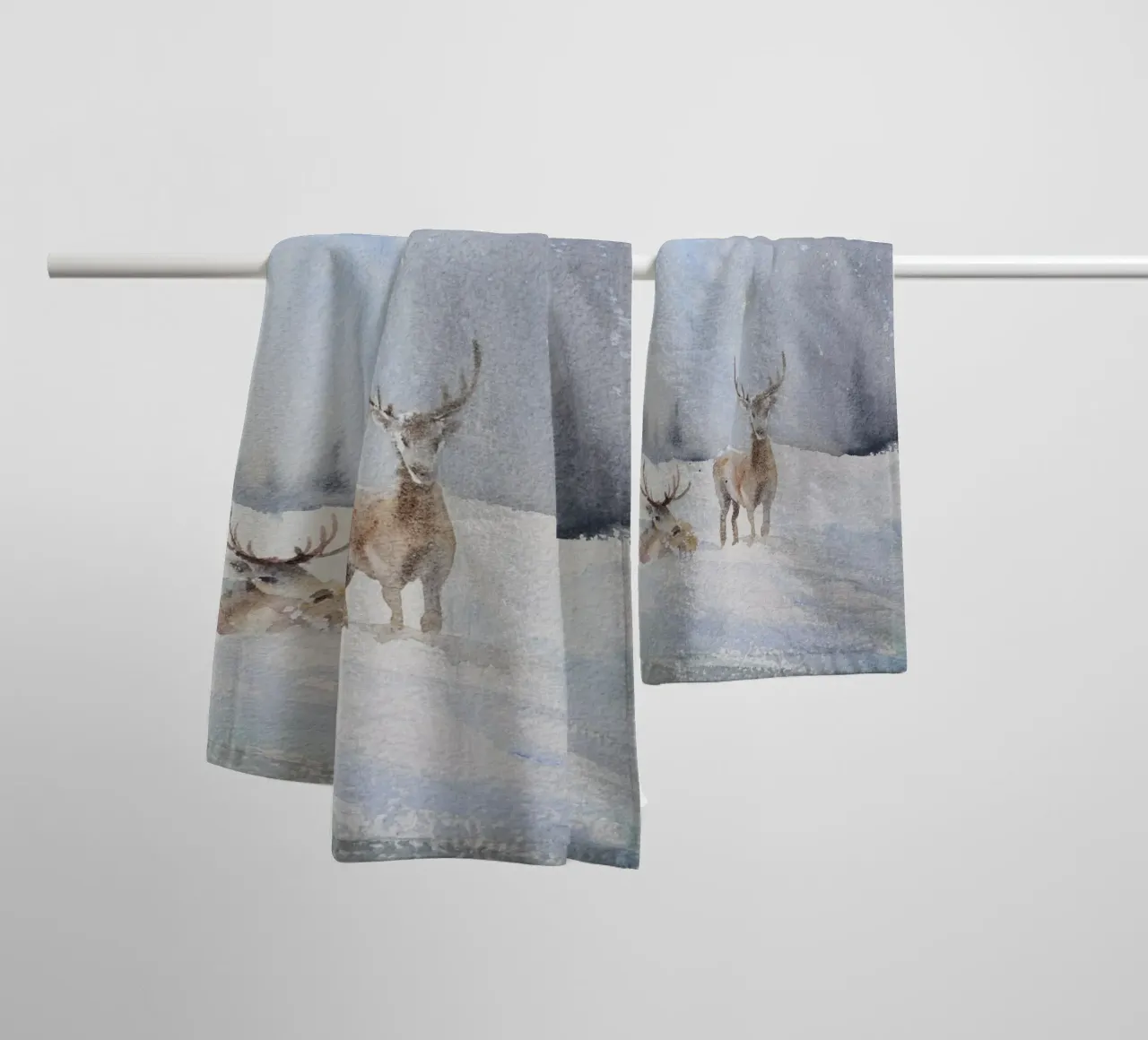Reindeer in a winter forest with the lettering Have a Holly Jolly Chr towel by Studio Vibe