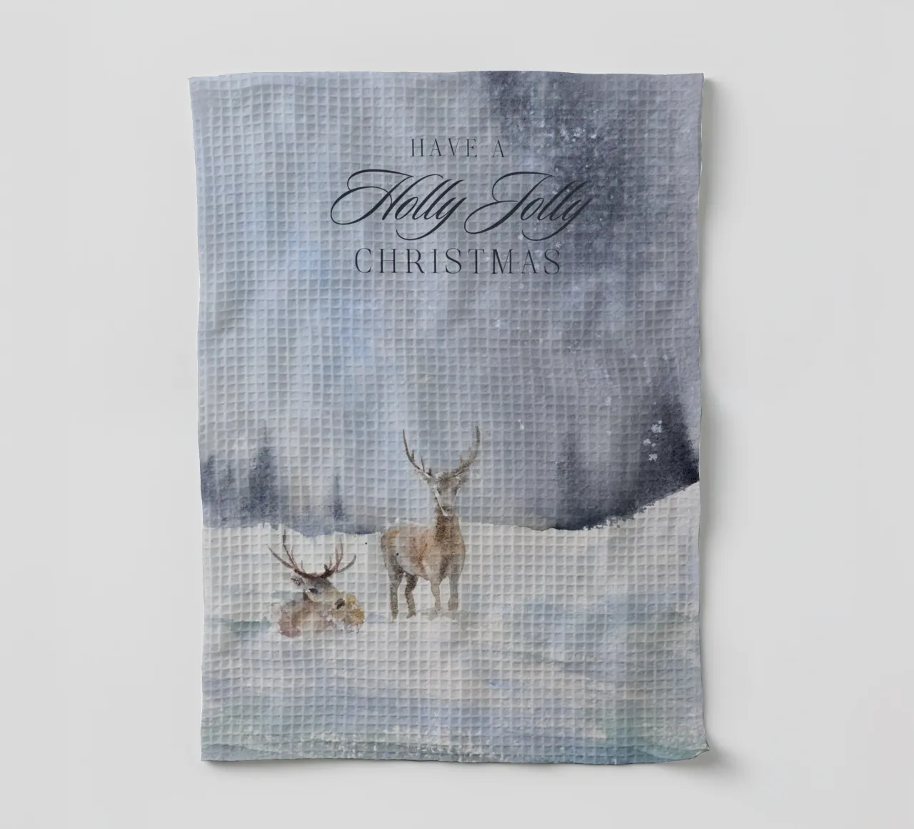Renne in un bosco invernale con la scritta Have a Holly Jolly Chr canovaccio da cucina da Studio Vibe