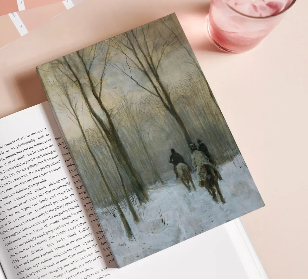 Three riders in a snowy winter forest under bare trees notebook by Studio Vibe